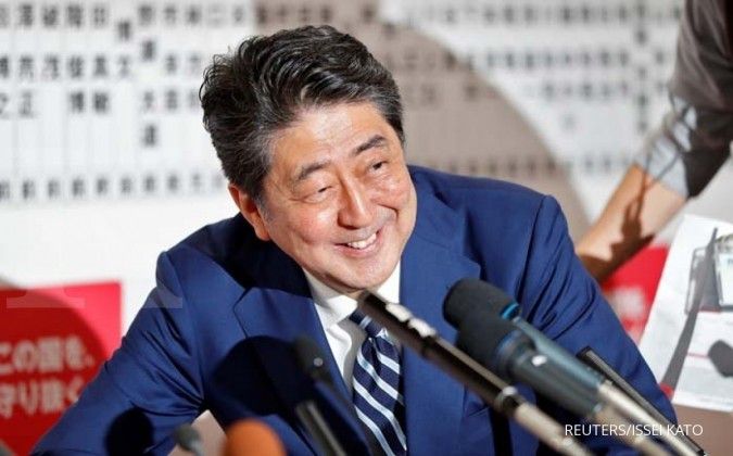 Japan PM Abe pledges to go ahead with sales tax hike next year