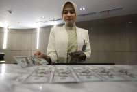 Mencermati Risiko Kredit Valas Kala Rupiah Semakin Loyo