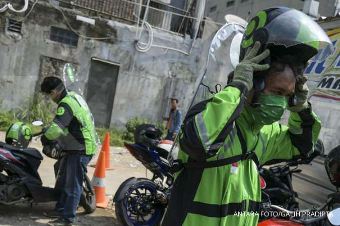 Jakarta's motorcycle taxis get backpack shield for virus battle