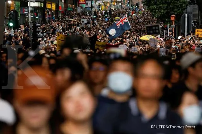 Hong Kong on security alert as thousands march in fresh wave of protests