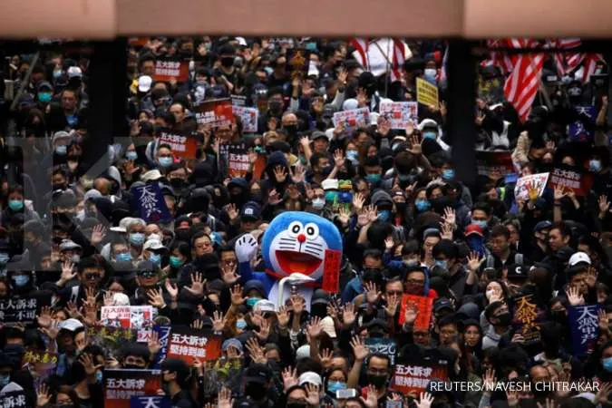 New chief of China's HK liaison office hopes city returns to right path