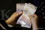 Bank Sentral Malaysia Denda Empat Bank Karena Gangguan Layanan 