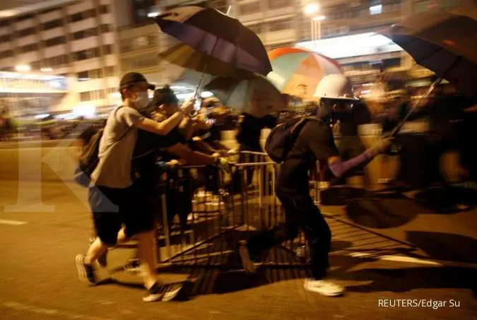 Hong Kong police fire tear gas as protests again roil the city