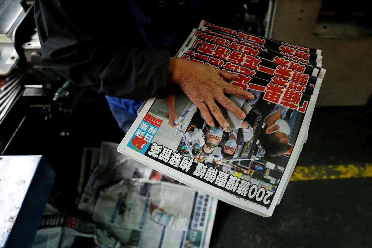 Hong Kong police arrest former editor in chief of Apple Daily