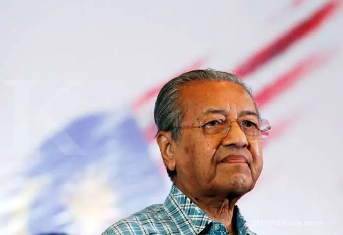 Malaysia's Mahathir quits but asked to stay as interim PM