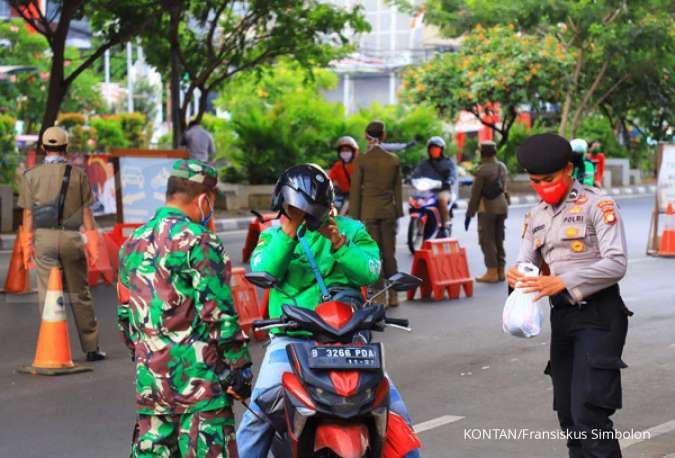 Soldiers, police enforce Indonesia's 