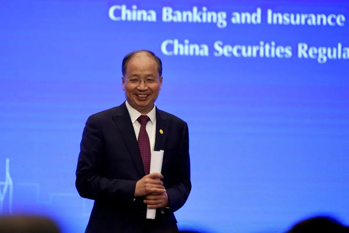 Mantan Kepala Regulator Pasar Modal China Yi Huiman Diselidiki atas Dugaan Korupsi